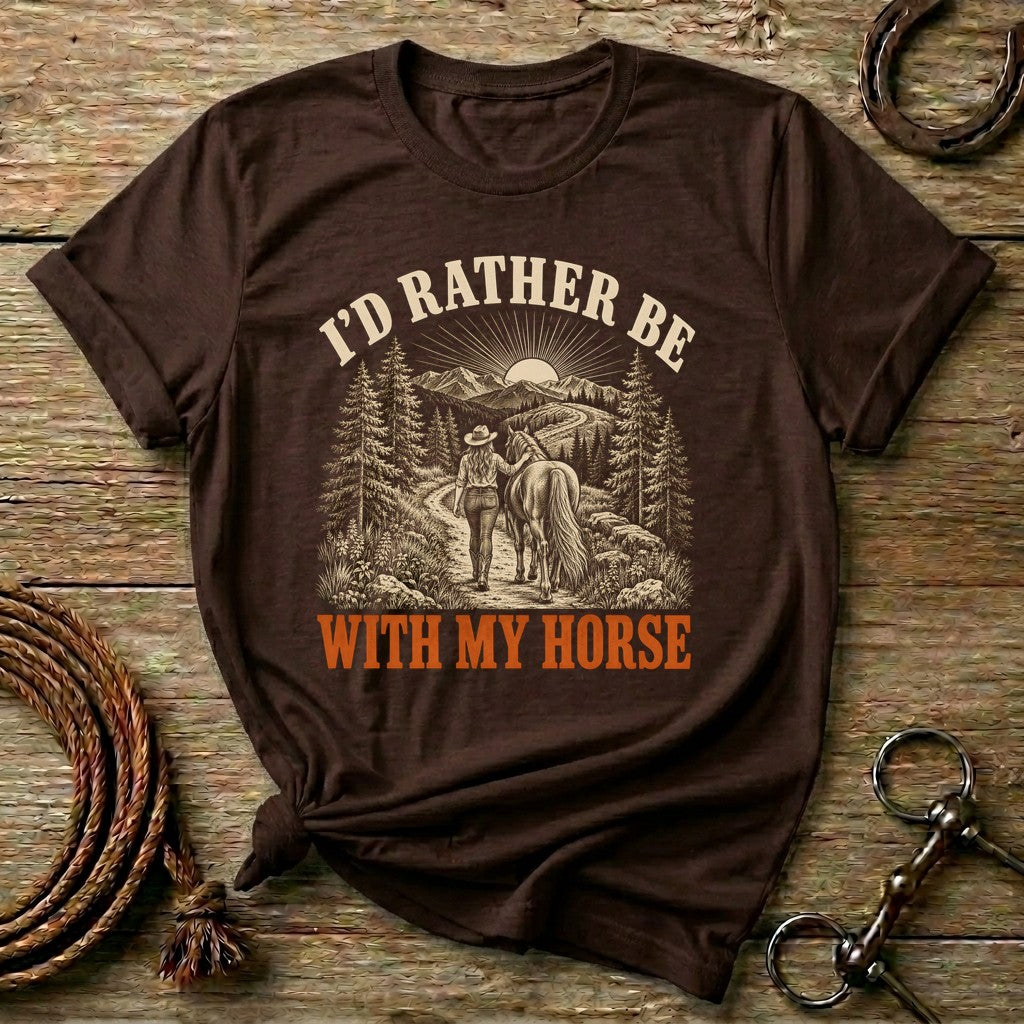 Dark Chocolate I'd Rather Be With My Horse t-shirt with a cowgirl walking her horse on a mountain trail