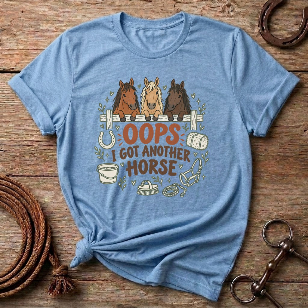 Light Blue Oops I Got Another Horse t-shirt with three horses peeking over a fence